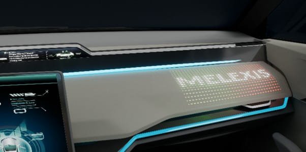 A modern vehicle interior features a sleek dashboard with illuminated digital accents. 
