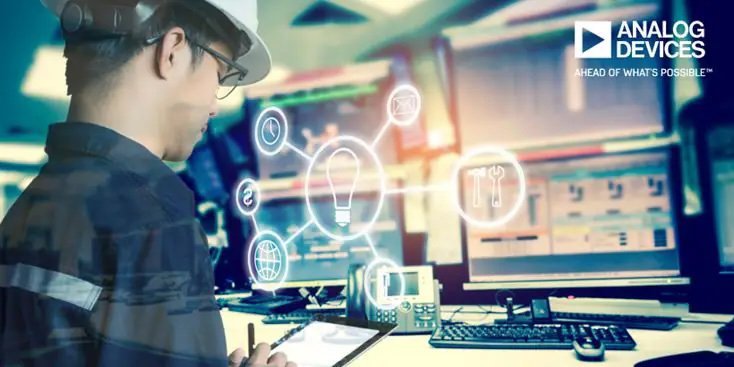 Un ingénieur portant un casque de sécurité utilise une tablette dans une salle de contrôle high-tech. Plusieurs moniteurs d'ordinateur affichent des données, tandis que des icônes numériques comme une ampoule et des outils sont superposées, suggérant l'innovation et la technologie. Le texte 'ANALOG DEVICES' et 'AHEAD OF WHAT'S POSSIBLE' est clairement visible dans le coin supérieur droit.