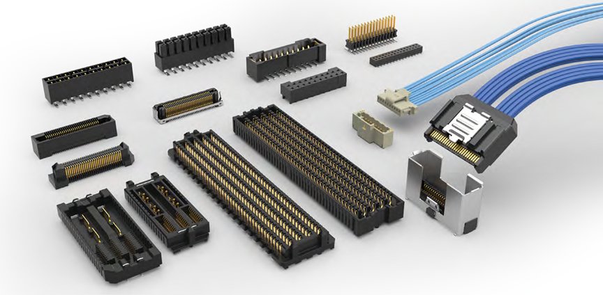 A variety of electronic connectors and cable assemblies are arranged on a light surface.