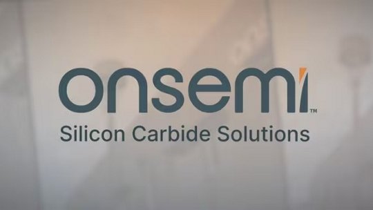 The image features the unmistakable onsemi logo with the phrase 'Silicon Carbide Solutions' clearly visible below it. The background is softly blurred, suggesting a professional or industrial setting. The overall palette is muted, focusing attention on the central text.