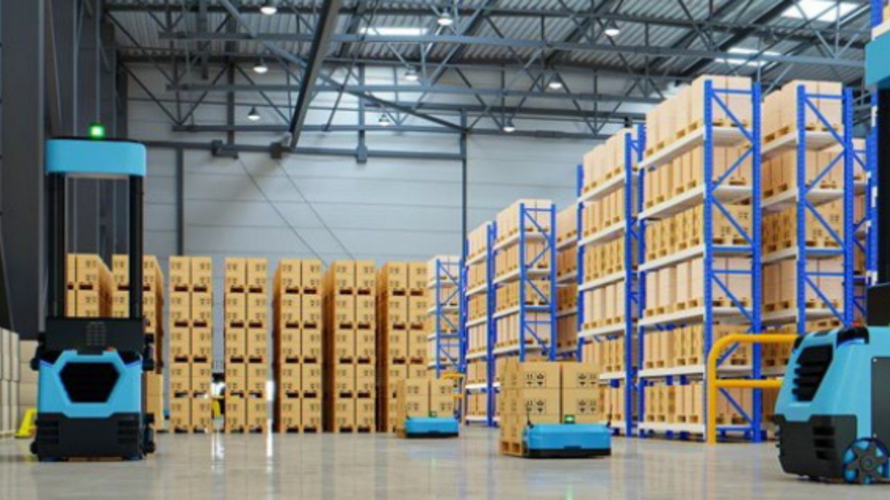 A modern agricultural robot navigates between rows of lush green plants inside a greenhouse. The robot is equipped with wheels and visible wiring, designed for automated crop management. The scene is brightly lit with natural sunlight, highlighting the advanced technology and healthy vegetation. No visible text or numeric values are present on the robot or in the environment.
