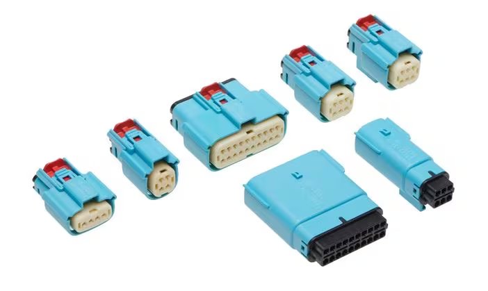 A collection of blue plastic automotive electrical connectors. The set includes various sizes and pin configurations, each connector featuring a red locking mechanism and visible pin layouts.