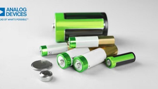 A collection of various battery types, including cylindrical and button cells, displayed on a light surface.
