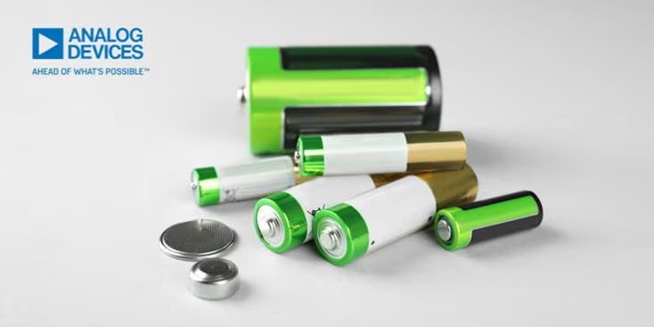 A collection of various battery types, including cylindrical and button cells, displayed on a light surface.