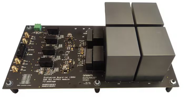 Top view of EVBUM2878G: an onsemi evaluation board designed for a 1200V SiC half-bridge power module. The board features multiple electronic components, connectors, and four large square capacitors or modules on the right.