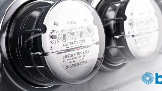 A detailed view of an electric meter showing its numeric dials and technical specifications. The lower right corner displays the 'bel' logo in blue.