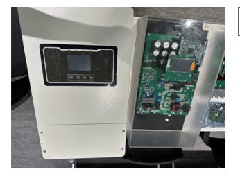 The image shows an electronic inverter device, with its outer casing partially open to reveal the internal circuit board and electronic components. The left side features a digital display and control buttons, while the right side displays capacitors, chips, and wiring.