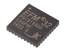 A close-up image of an EFM32 PG1B100GC microcontroller chip. The chip is black with white printed text, including model and batch numbers.