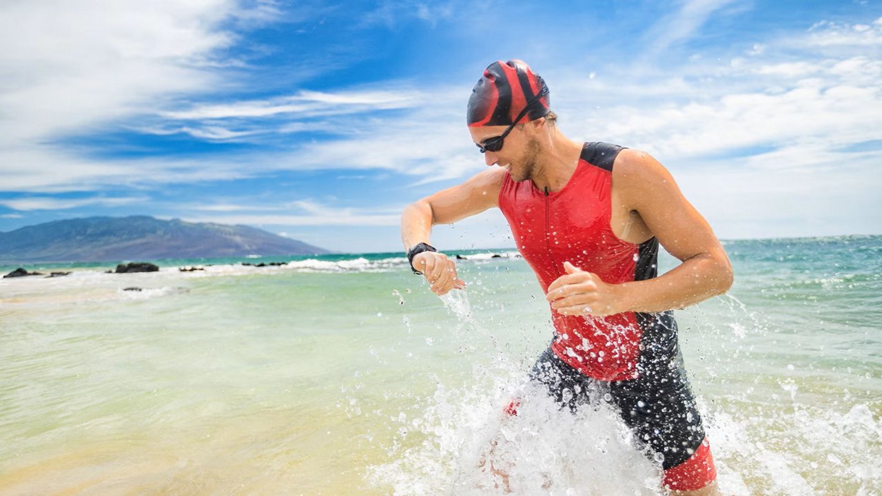 Man leaving water with smartwatch