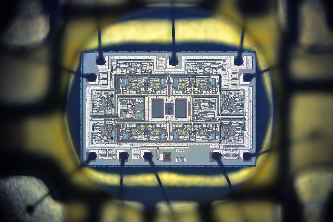 Close-up of a blue electronic circuit board featuring multiple chips, connectors, and two Ethernet ports.
