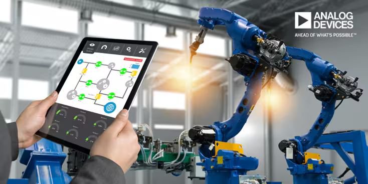 A modern industrial setting featuring robotic arms in operation, controlled through a tablet interface displaying a system diagram.