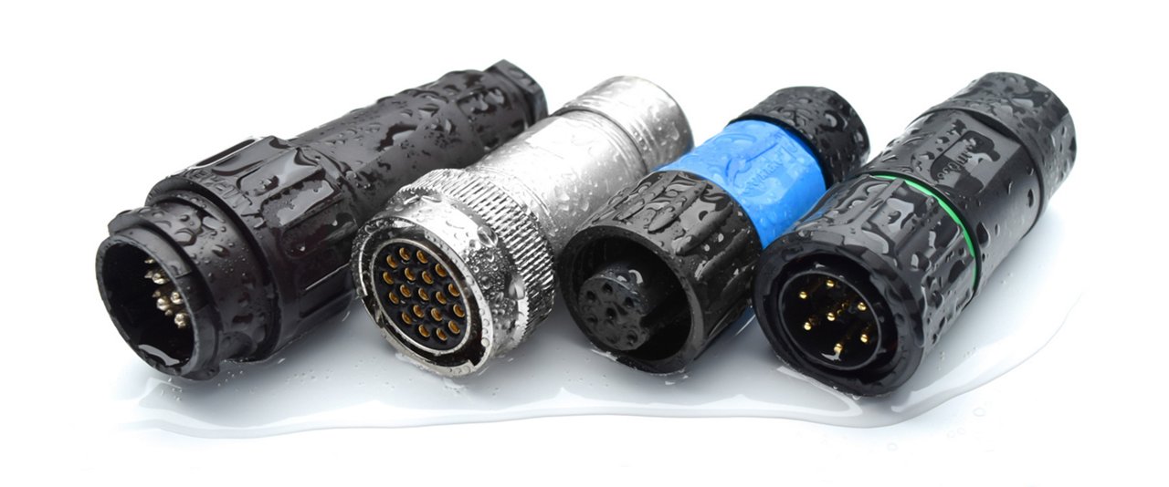 A group of four circular electrical connectors is displayed on a white background.