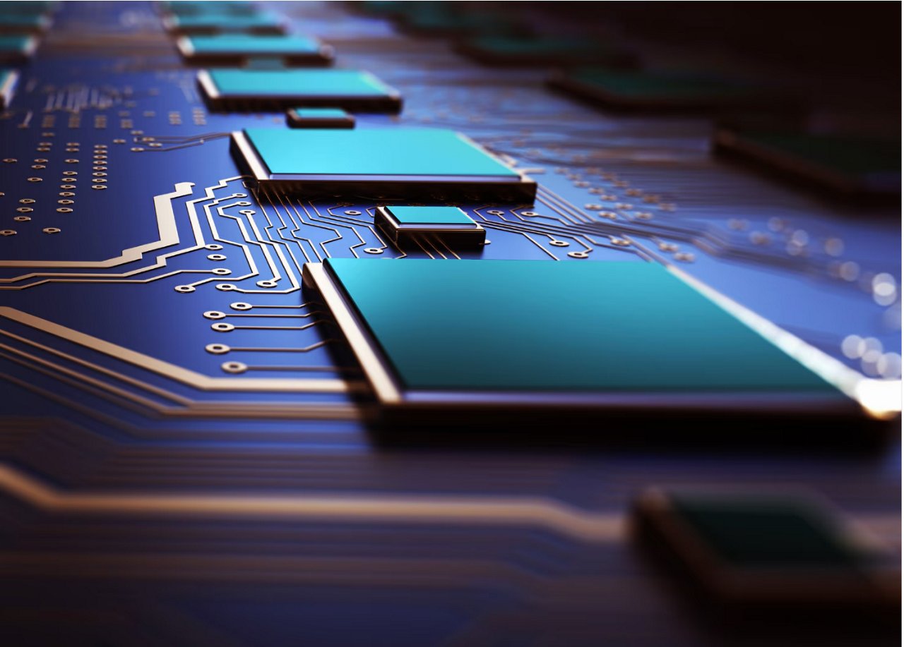 A detailed close-up view of a computer circuit board with prominent microchips and intricate gold circuitry. The setting is highly technical, emphasizing the precision and complexity of electronic hardware.