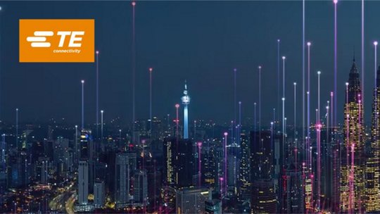 Image of city skyline at night TE Connectivity logo displaying