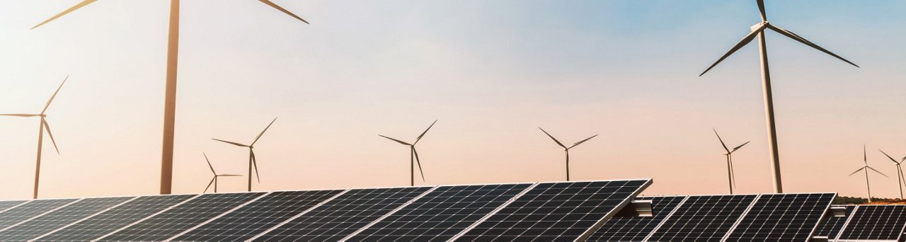 Clean energy concept. Solar panels with wind turbines