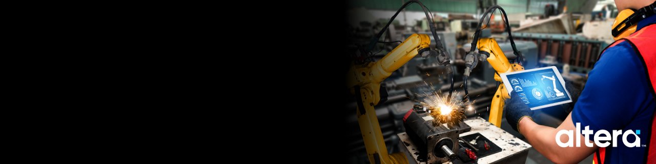 A factory worker operates yellow robotic arms on an industrial production line. 