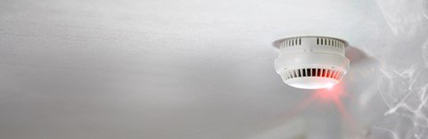 Image of smoke detector illuminated smoke nearby