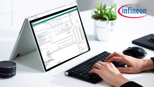 A person types on a wireless keyboard connected to a tablet-style laptop displaying an electronic circuit design interface.