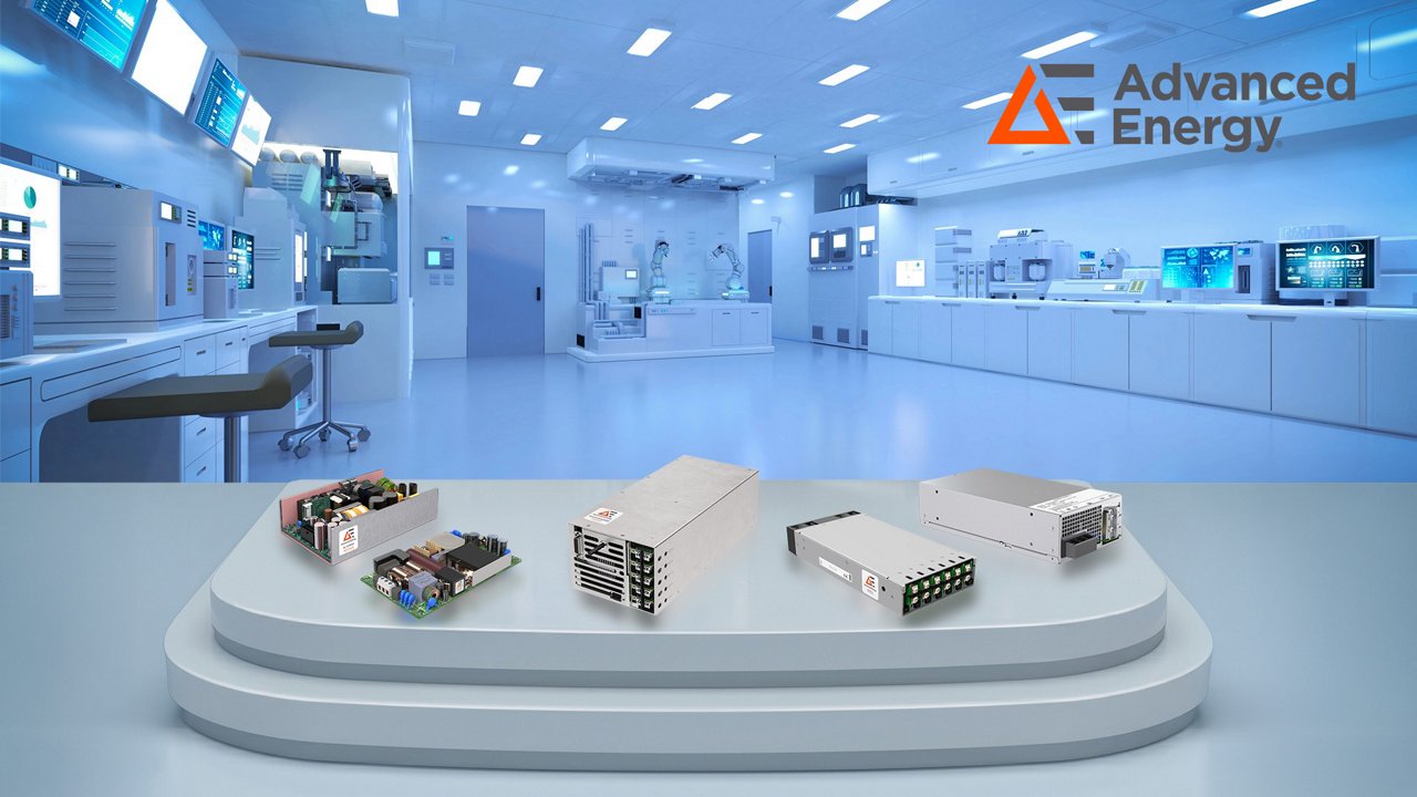 Several industrial power supply units are displayed on a multi-tier platform in the foreground.