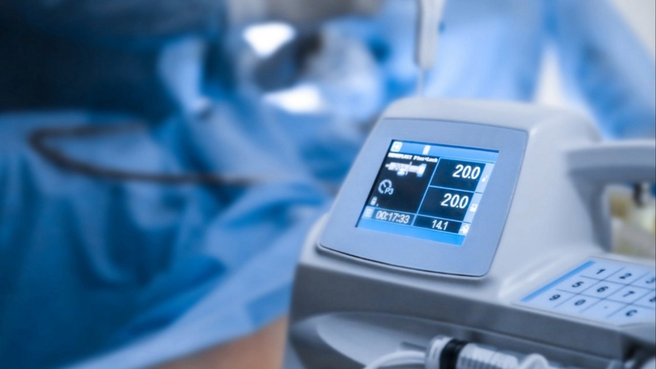 A close-up of a medical device displaying numeric readings, including '200' and '141', in a surgical environment.A close-up of a medical device displaying numeric readings, including '200' and '141', in a surgical environment.