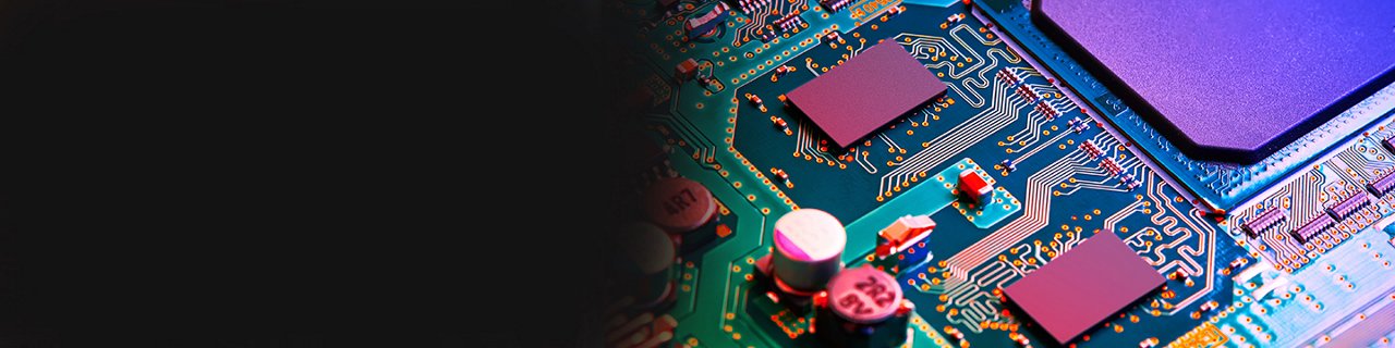 Close-up view of an electronic circuit board with microchips and components. 