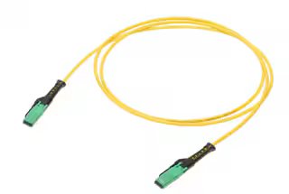 A single yellow fiber optic patch cable is coiled on a white background, featuring green connectors at both ends. The cable is designed for high-speed data transmission and is commonly used in networking or telecommunications setups.