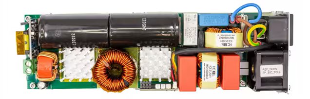 This image shows the internal components of an electronic power supply circuit board. The board features large capacitors, copper coils, heat sinks, and various colored wires and connectors. Visible text includes '450V 330uF' on the capacitors and 'T2.5AH 250V' on a fuse.