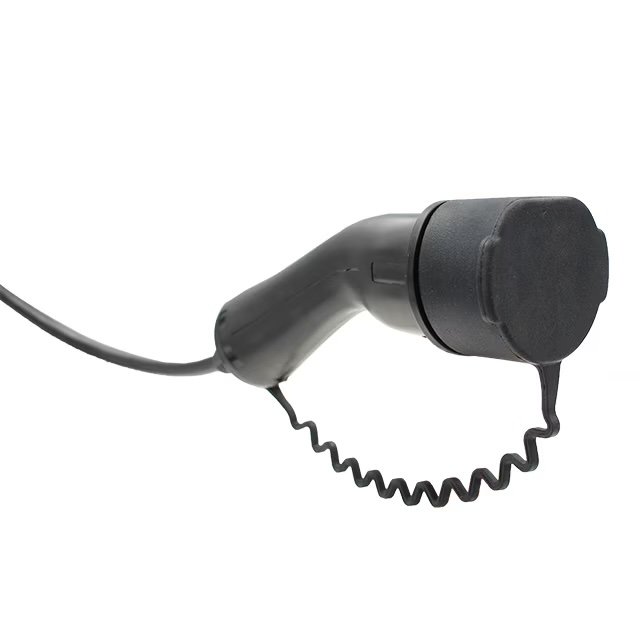 A black handheld barcode scanner and the scanning head is capped. The device features an ergonomic handle and a coiled cable extending from the base.