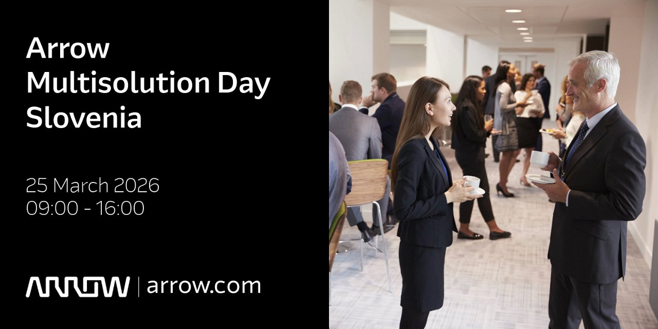 A professional networking event is taking place at Arrow Multisolution Day Slovenia, as indicated by the event signage.