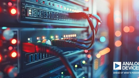 A close-up view of a server rack featuring connected cables and illuminated indicator lights