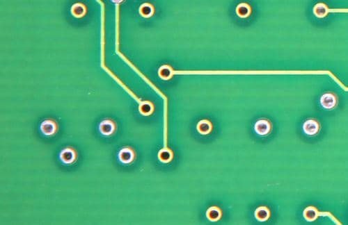 Arrow Donuts of the PCB Article Content Image Close-up of Green Circuit Board Design