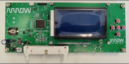 A green circuit board featuring an LCD screen and multiple electronic components, including buttons and connectors. The Arrow Electronics logo is clearly visible on the board.