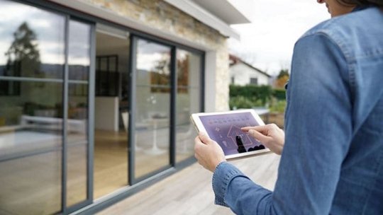 Woman Using Tablet for Smart Home Control