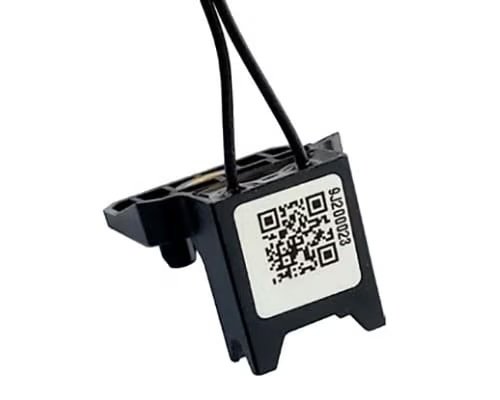 A close-up image of a small electronic sensor component featuring two attached wires.
