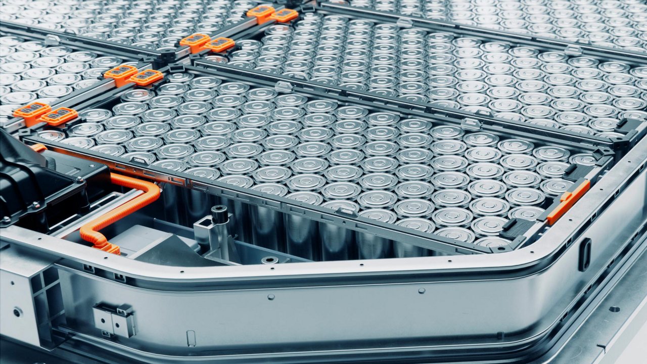 High-angle close-up of a large electric vehicle battery module filled with cylindrical cells.