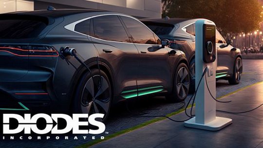 Two sleek electric vehicles are parked and charging at a modern station during nighttime.