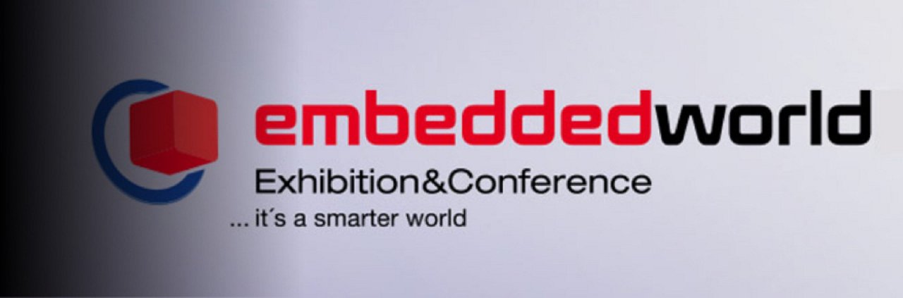 A digital banner features the 'embedded world Exhibition & Conference' event title prominently displayed. 