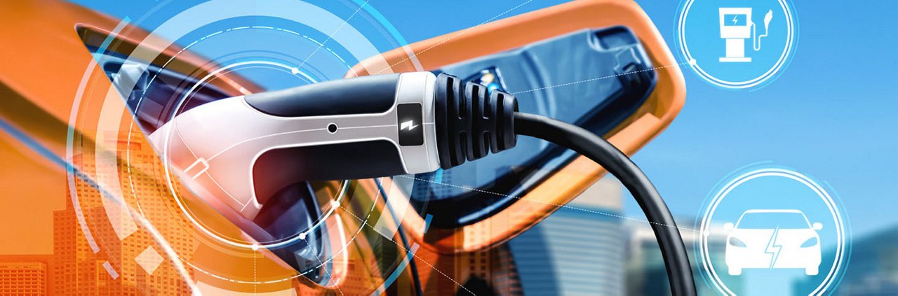 A close-up view of an electric vehicle charging cable connected to a car in a modern urban setting.