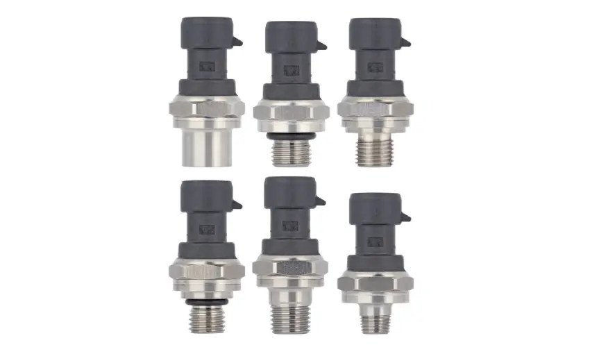 A collection of six identical pressure sensors featuring metallic bases and black plastic tops. 