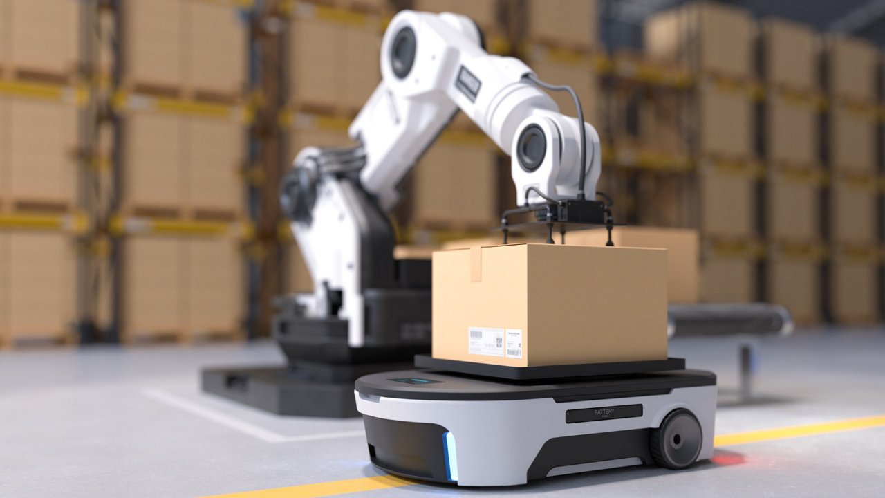 A robotic arm places a cardboard box onto an autonomous mobile robot in a modern warehouse setting