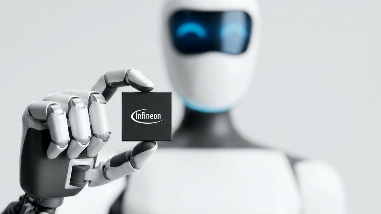 A sleek humanoid robot holds a small Infineon microchip between its fingers