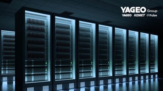 Row of dark server racks with illuminated panels, showcasing a data center environment.