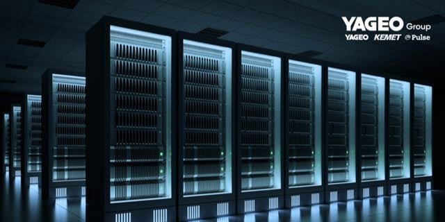 Row of dark server racks with illuminated panels, showcasing a data center environment.