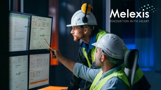 Image of engineers discussing results on a chart