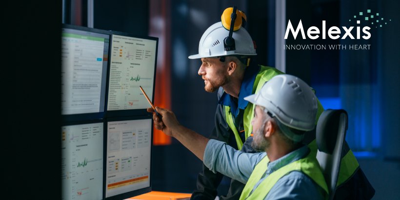 Image of engineers discussing results on a chart