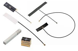 Assorted wireless communication antennas, including patch, whip, and loop antennas, with various cables and connectors.