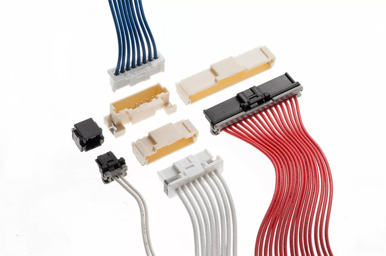 A collection of various electronic connectors and cables displayed on a neutral background