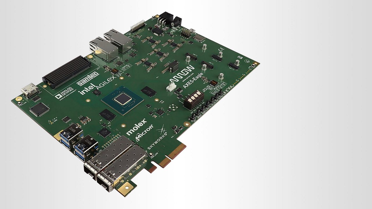 A detailed view of a green circuit board featuring multiple ports, chips, and connectors. 