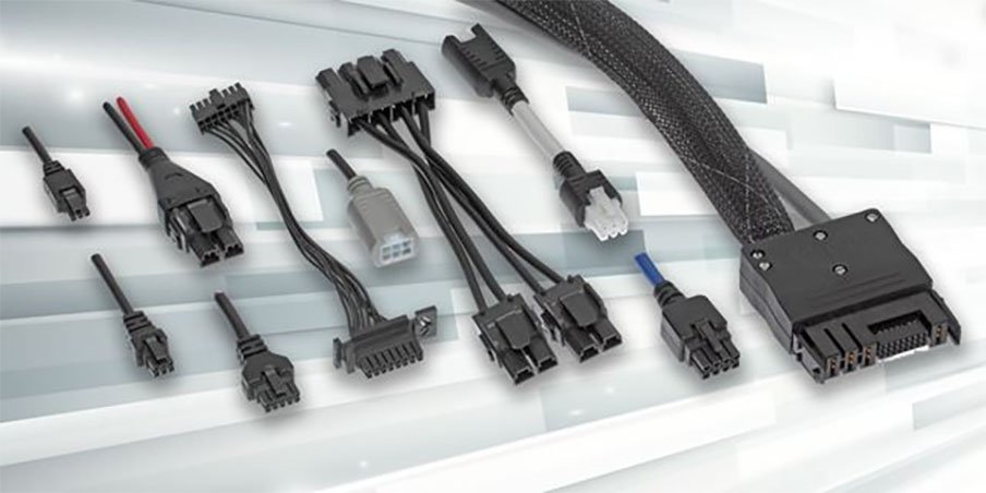 Assorted black and gray electrical connectors and wires with various configurations.