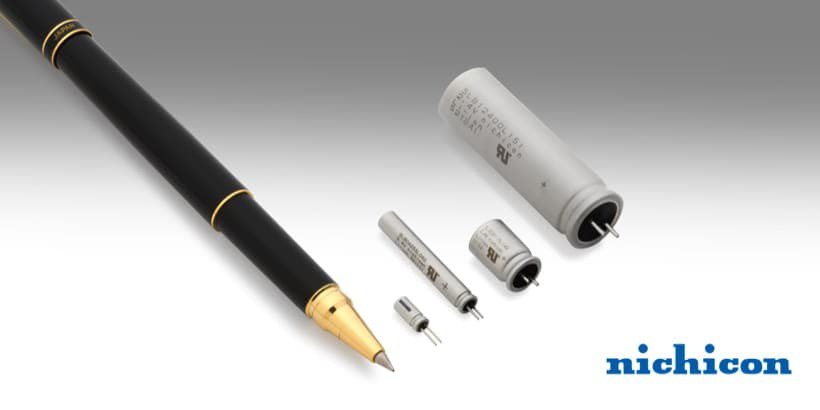 A collection of Nichicon capacitors displayed alongside a black fountain pen with gold accents
